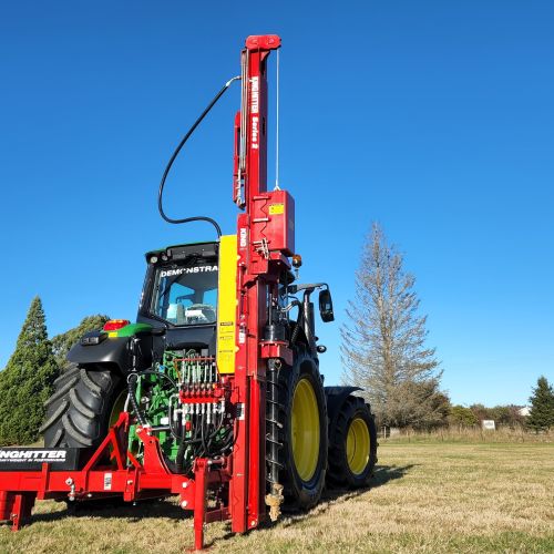 Expander Telescoping mast post driver mounted to rear of New Holland tractor